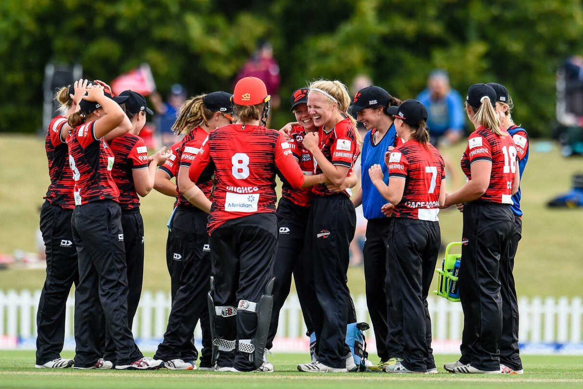 Gabby Sullivan (white headband) celebrates her hat-trick with  Magicians team mates during the Dream11 Super Smash T20 womens cricket match, Canterbury Magicians v Wellington Blaze at Hagley Oval, Christchurch, New Zealand, 15th December 2019.Copyright photo: John Davidson / www.photosport.nz