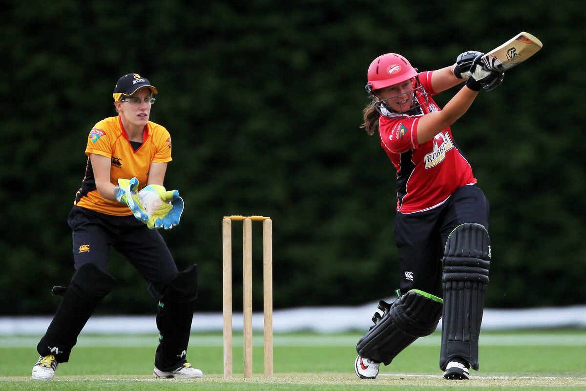 Hayley Jensen batting for Canterbury, Andrea Stockwell behind the stumps for Wellington. Canterbury Magicians v Wellington Blaze. Action Cricket Twenty20, womens cricket match, Lincoln No. 3, Lincoln University, Thursday 29 December 2011. Photo : Joseph Johnson / photosport.co.nz